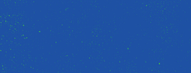 Vibrant blue background with a speckled texture. The background is a deep blue with scattered green specks, creating a dynamic blue effect. Speckled wall texture background. Blue background vector.