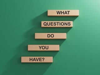 Questions symbol. Wooden blocks with words What Questions do you have.Business and What Questions do you have concept. Copy space.3D rendering on green background.