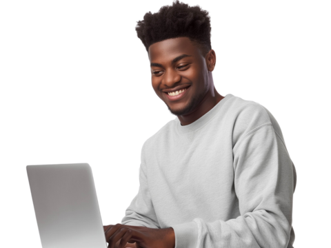 Smiling young man using a laptop, engaged in online work or study