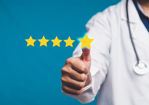 Doctor giving thumbs up with five-star rating in healthcare quality concept.