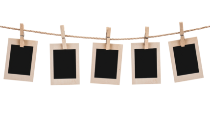 blank photo frames on rope isolated on transparent white background, clipping path