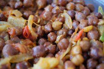 Delicious and Savory Chickpeas Dish Accompanied by Colorful Fresh Vegetables