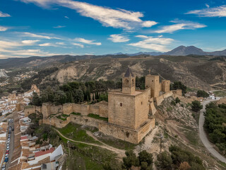 Aerial view of Antequera, mediaval Spanish town with huge castle and city walls in Andalusia Spain