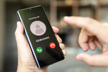 Phone call from unknown number. Scam, fraud or phishing with smartphone concept. Prank caller,...