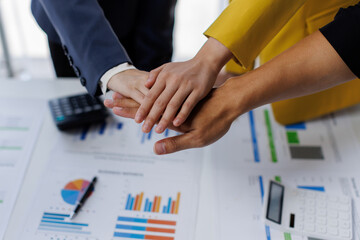 Business team standing hands together, Volunteer charity work. People join for cooperation success...