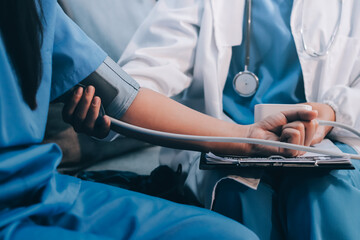 The doctor woman hand use the pulse meter to measure the pressure of the patient, medical checkup concept.