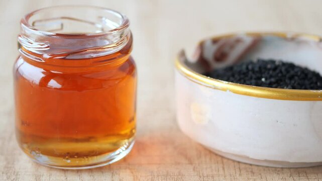Black Cumin seed and oil in a container 