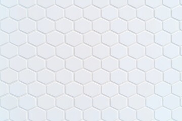 Fototapeta premium A close-up view of a textured hexagonal tile pattern in a light shade, creating a clean and modern aesthetic.