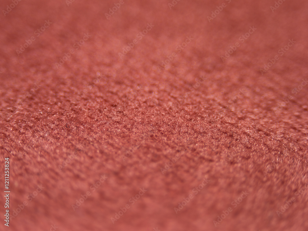 Aufkleber A close up of a red fabric with a fuzzy texture