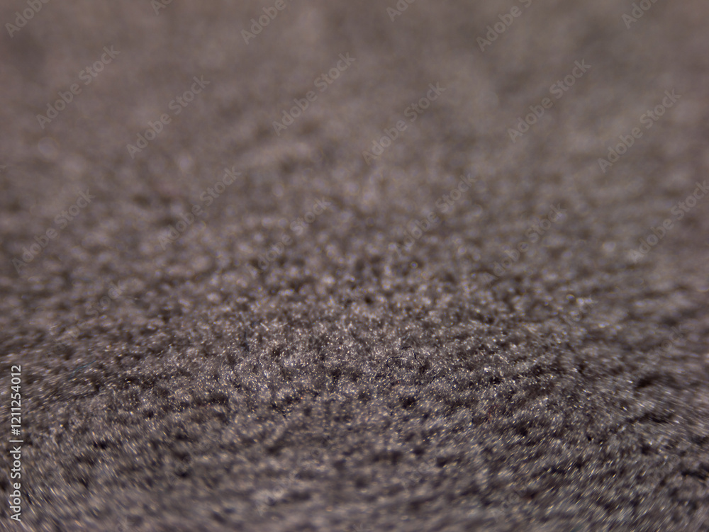 Poster the image is a close up of a fuzzy, gray fabric