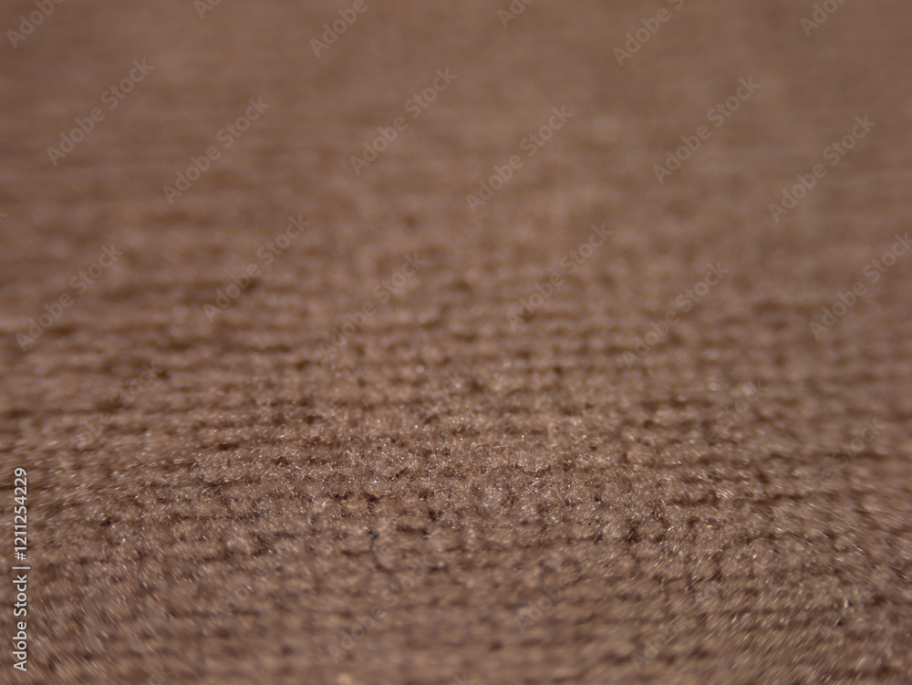 Aufkleber the image is of a carpet with a brown color