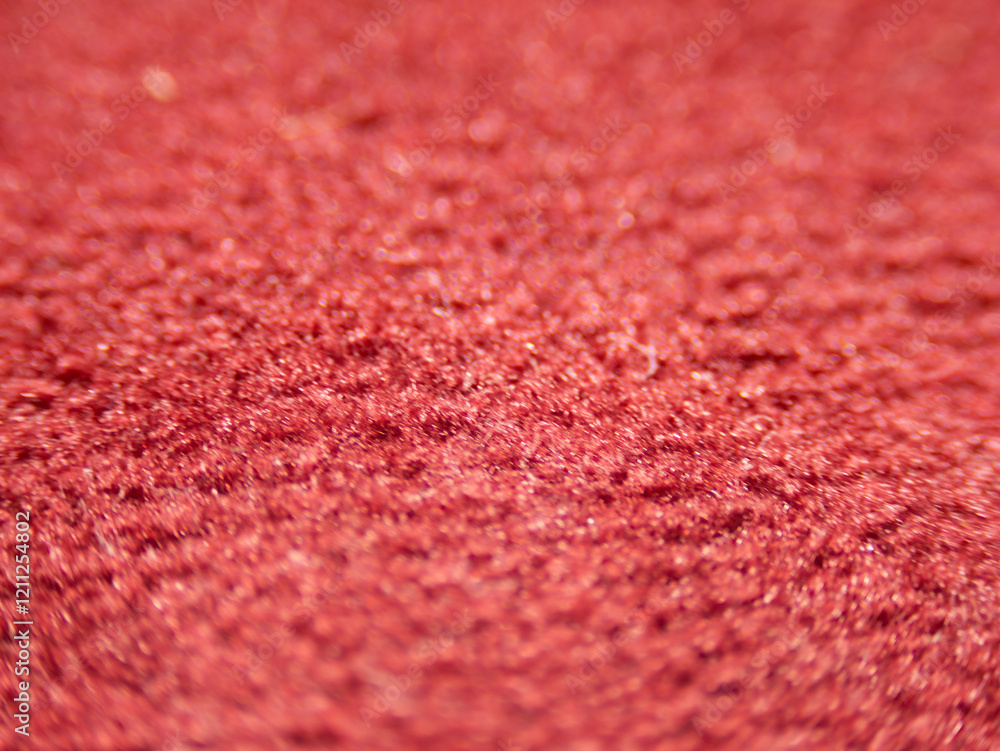 Poster A close up of a red carpet with a fuzzy texture