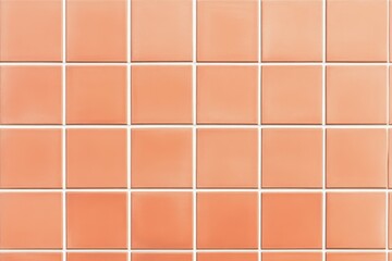A grid of peach-colored ceramic tiles arranged neatly, showcasing a uniform pattern with white grout lines.