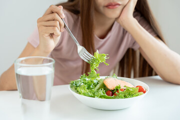 slim body asian women very bored diet food, dieting female choose low calories food for diet. Good...