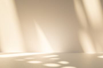 Studio style background wall decoration presentation uses white and beige tones. with shadows cast from a nearby window, concept creating a decorative backdrop.	