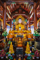 Buddhist golden Buddha statue in a pagoda temple in Nha Trang, Asia.