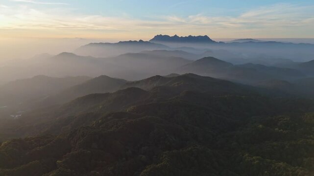 Aerial view foggy mountain forest landscape with morning colorful sunrise sky. (Doi Luang Chiang Dao) thailand . nature background.