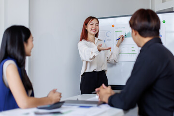 Business people planning at whiteboard in office meeting,team business work with documents tax laptop computer in office.