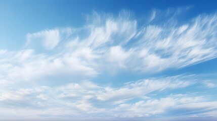 Obraz premium Soft wispy cirrus clouds floating through a peaceful serene sky create a tranquil atmospheric backdrop for nature inspired scenic designs and minimalist backgrounds
