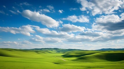 Majestic cumulus clouds filled the sky casting dramatic shadows and creating a moody atmospheric ambiance over the rolling undulating hills in this breathtaking scenic landscape