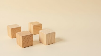 Obraz premium Simple wooden blocks arranged on a pale background showcasing minimalist design