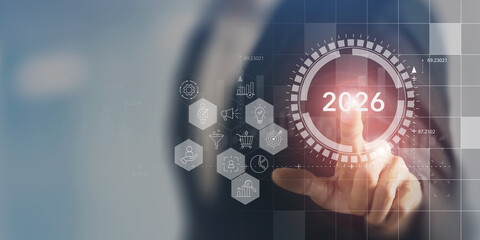 2026 business planning. Marketing and business strategy, goals and achievement concept. Touching virtual screen with icons related to marketing, business strategies, digital marketing management.