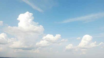 Blue sky background with white clouds. Cumulus white clouds in the blue sky.