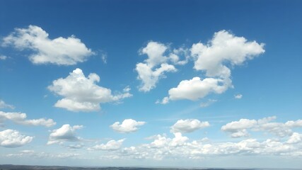 Blue sky background with white clouds. Cumulus white clouds in the blue sky.