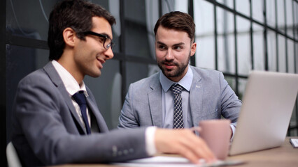 Business people discussing over new business project in office.