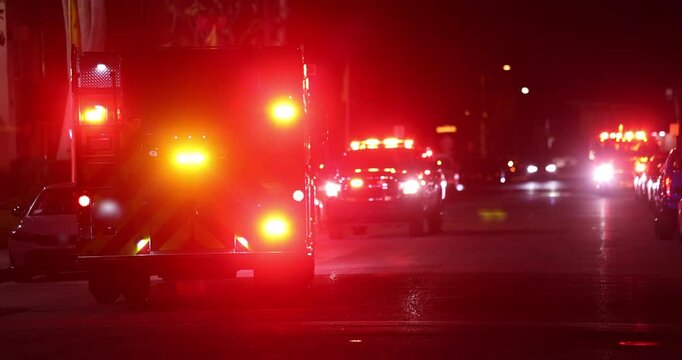 A fire engine responds to the scene of an emergency at night.