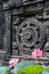 Fototapeta premium A dynamic shot of a Buddhist Wheel of Dharma carved into a stone temple wall, with lotus flowers nearby