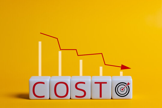 Cost reduction concept. pointing down arrow of the graph with cost reduction business finance on a cube. Business, technology, cost management, cut budget.