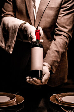 Sommelier with bottle for mockup