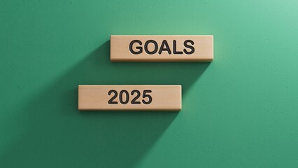 2025 Happy New year banner. Text GOALS, 2025 numbers and target icon on wooden cube blocks. Business goal plan and achievement concept.3D rendering on green background.
