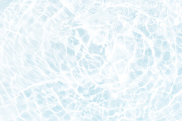 Blue water with ripples on the surface. Defocus blurred transparent blue colored clear calm water surface texture with splashes and bubbles. Water waves with shining pattern texture background.