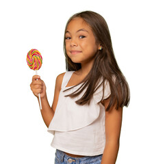 Cheerful smiling brunette child girl holding a lollipop standing isolated over transparent background. PNG transparent.