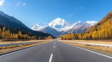Fototapeta premium Majestic Mountain Landscape with Clear Sky and Autumn Foliage Along the Road Highlighting Scenic Beauty of Nature in Remote Wilderness