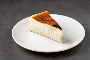 Popular Spanish cheesecake called San Sebastian cheesecake on a stone table