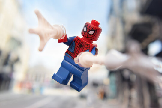 Lego minifigure of flying Spiderman. Editorial illustrative image of popular children toys.