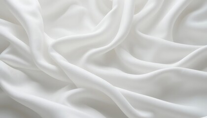 Obraz premium Close-up shot of luxurious white silk fabric, elegantly draped and showcasing its smooth texture and subtle sheen, perfect for fashion design or textile backgrounds.