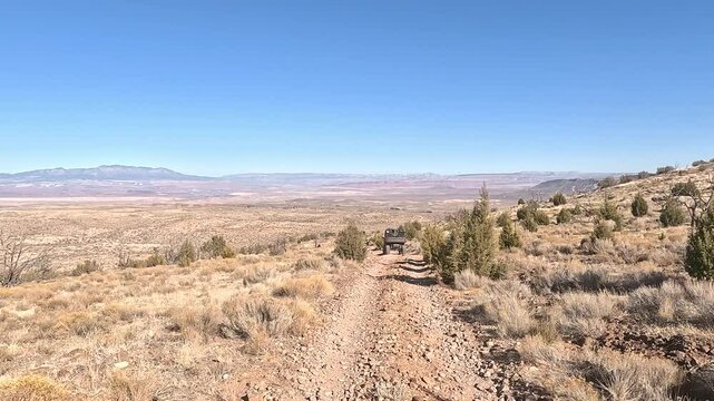 Utah desert rough rocky trail ride recreation 4x4 POV. Off road trail riding in 4x4 all terrain vehicle for sport and recreation. Desert landscape, dusty trails and recreation areas. Southwest Utah