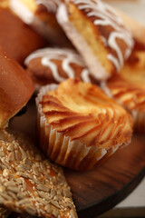 Delicious assortment of baked goods on a wooden platter ready for enjoyment at a casual gathering