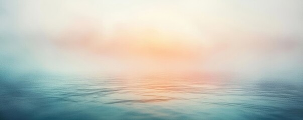 Obraz premium Soft watercolor idea. A serene ocean view at sunset, with soft colors blending into the misty horizon.