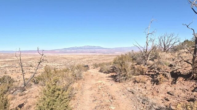 Utah desert rugged trail ride recreation 4x4 POV. Off road trail riding in 4x4 all terrain vehicle for sport and recreation. Desert landscape, dusty trails and recreation areas. Southwest Utah