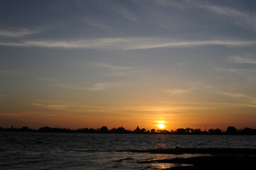 Sunset at the Nuwara Wewa artificial lake and largest of the three man-made reservoirs on the east side of the Anuradhapura city in Sri Lanka