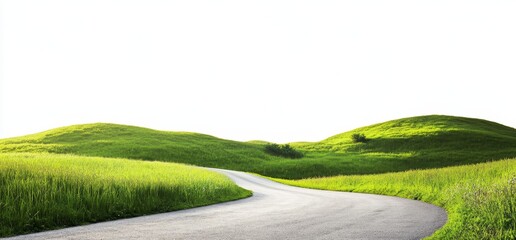 Winding road through green hills and grassy fields under a bright sky.