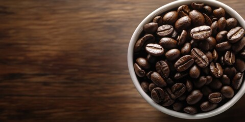 Coffee beans in a white bowl on a rustic wooden table background, deep brown tones highlighting the beans' rich texture and natural shine.