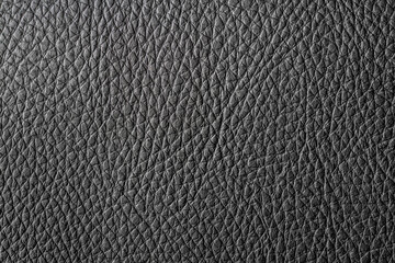The texture of genuine leather. Rough genuine black leather.