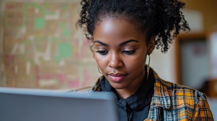 African American woman closely examining cadastral map on laptop screen Generative AI