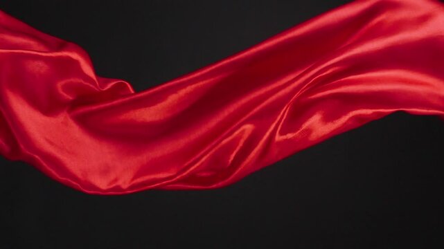 Abstract soft red silk background luxury wave cloth satin pastel color fabric. 
